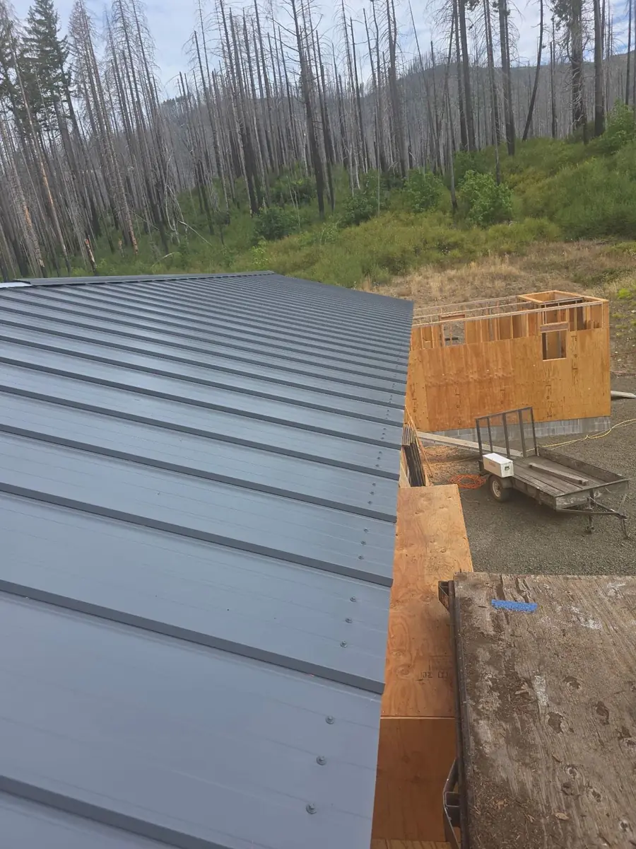 Charcoal metal roof installed by Mistletoe Construction on a new build in rural Douglas County Oregon
