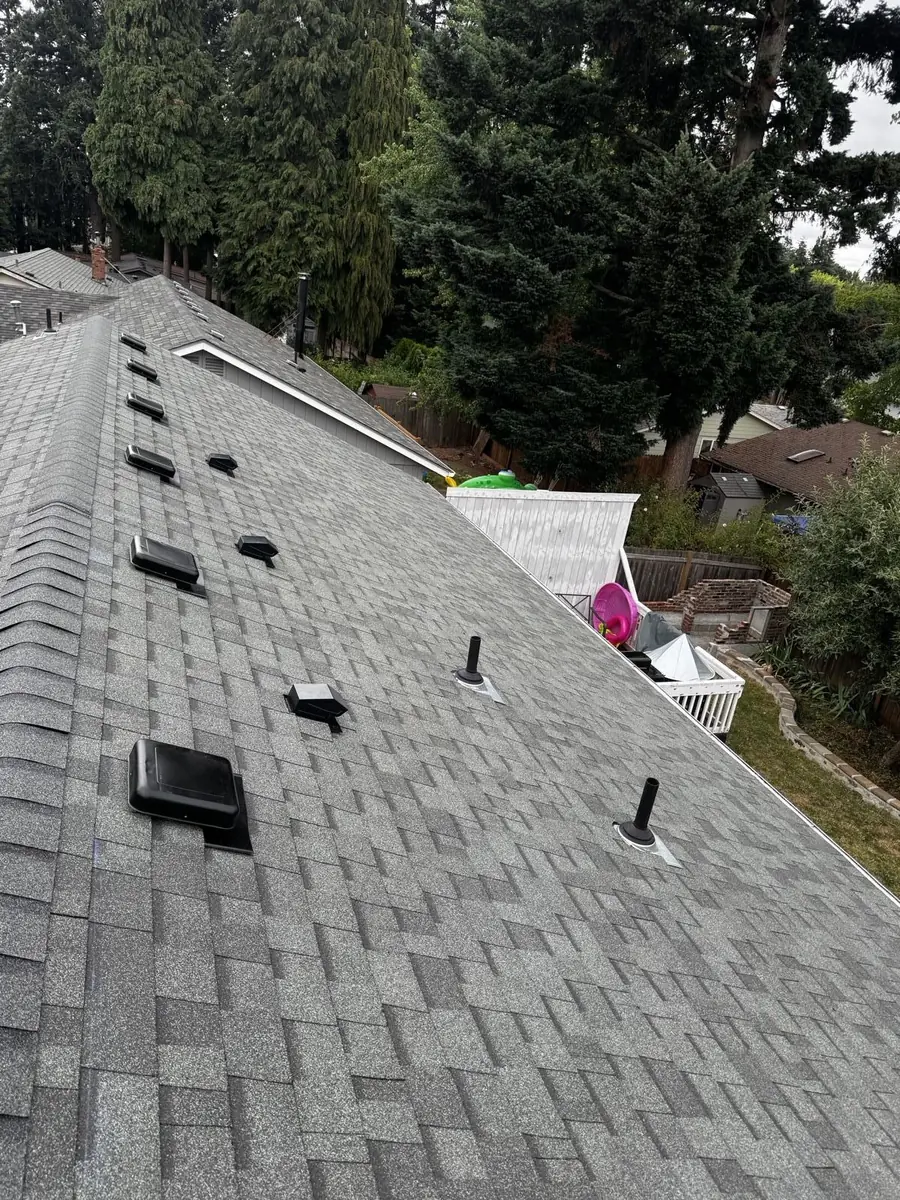 Completed shingle roof with new vents installed by Mistletoe Construction in Douglas County Oregon