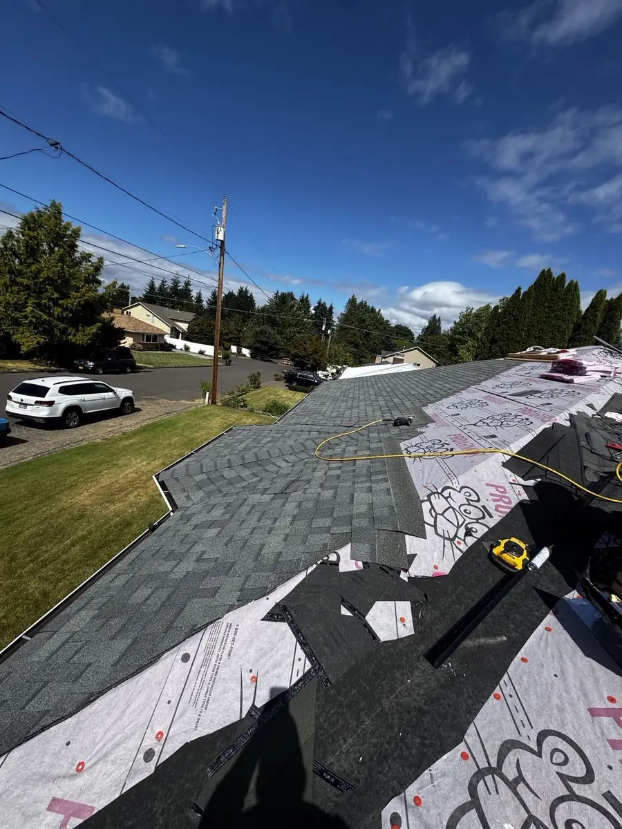 Partially shingled roof slope during a Mistletoe Construction re-roof project in Douglas County Oregon