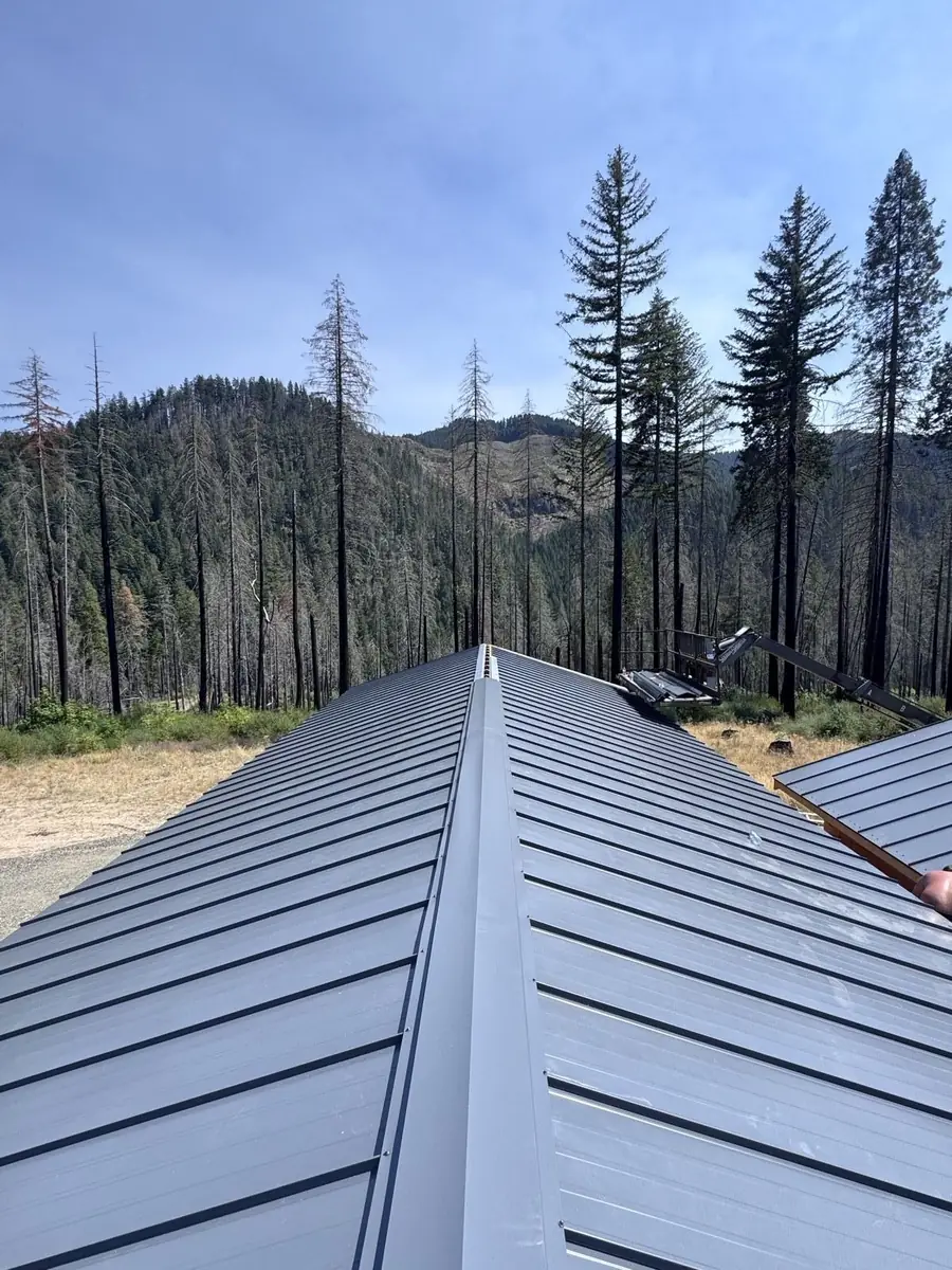 New standing-seam metal roof installed by Mistletoe Construction on a rural Douglas County property